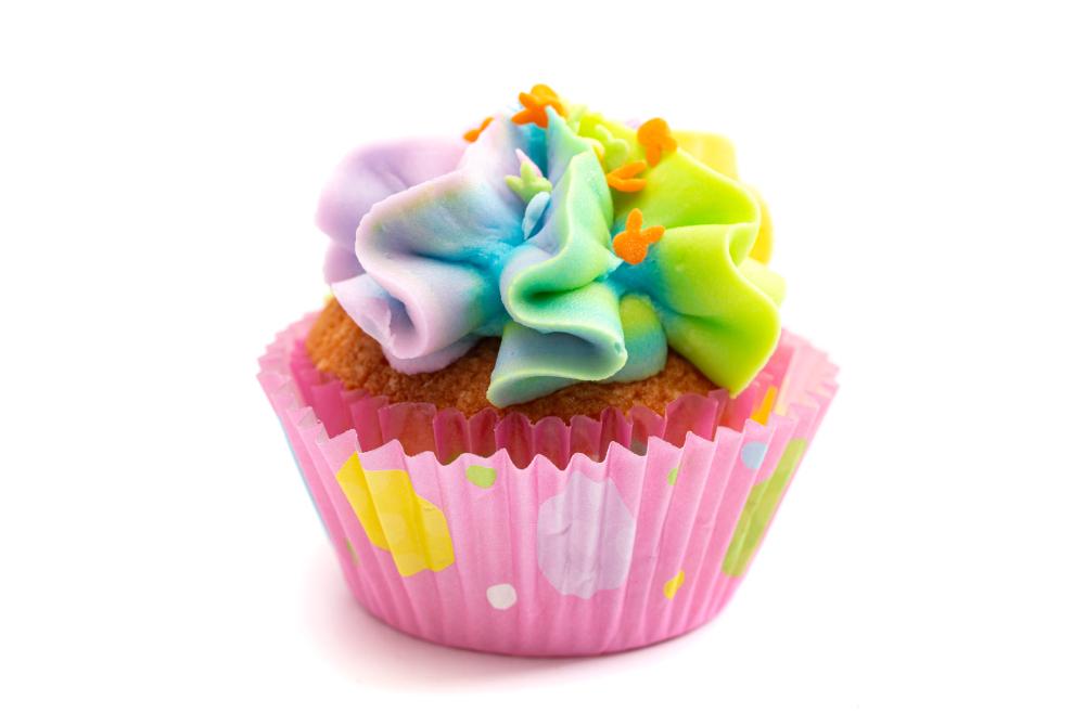 colorful rainbow cupcake isolated on a white background