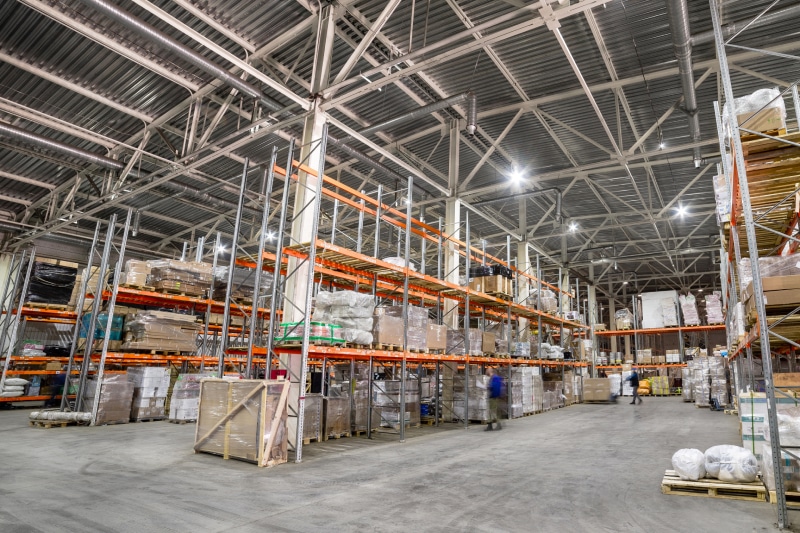 people walking around a warehouse working